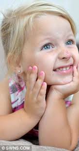 Toddler Connie Lloyd born with 'clown-nose' birthmark has 3 hour surgery