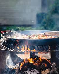 Seafood Paella On An Open Fire A Couple Cooks Recipe Open Fire Cooking Paella Campfire Food