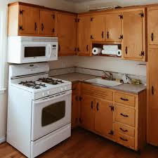 How to paint laminate cabinets before after use old kitchen. Painting Kitchen Cabinets Budget Remodel Before After Apartment Therapy
