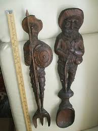 Wooden like or characteristic of wood (woodenly) ungraciously: Carved Figures Fork Spoon Vatican
