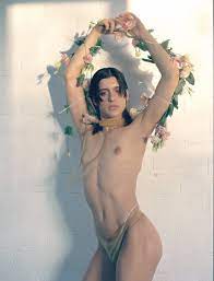 Arca poses half-nude with flowers : r/ArcaMusic