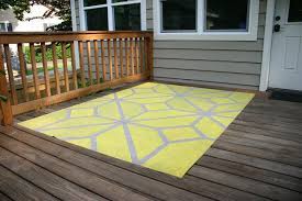 Painted rug on wood deck. How To Paint An Outdoor Area Rug