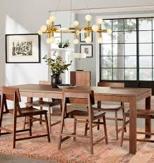Ideally, your dining room rug should be about four feet longer and wider than your table. Blog Choosing The Right Dining Room Rug Shabahang Rug Gallery Persian And Oriental Carpets