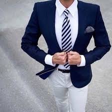 A Smart Casual Combination Of A Navy Blue Coat And White Chinos Can Maintain Its Relevance In Many Different Circumstanc Mens Outfits Blue Suit Men Stylish Men