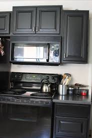 Black Appliances With Grey Cabinets Black Cabinets With Black Appliances Google Search Black Kitchens Black Kitchen Cabinets Black Appliances Kitchen