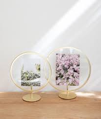 The brackets with the frames are suspended from the ledge, which allows them to be moved around to create various layouts. Shop Modern 4x6 5x7 8x10 And Collage Picture Frames For Your Home Umbra Europe