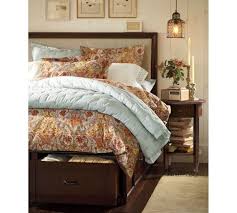 The simple platform bed frame has three pullout drawers on one side, all of which have plain fronts (no handles or notches) and sit flush side by side. Love Everything About This No More Dust Under The Bed And Additional Storage Bedroom Design Inspiration Bed With Drawers Home