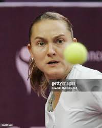 France's Mary Pierce hits the ball back to her compatriot Emile Loit...  News Photo
