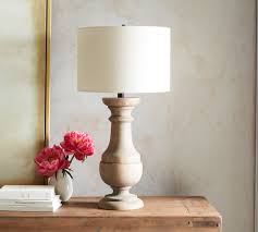 They give you additional light where you need it while also adding a bit of personality. Finn Turned Wood Table Lamp Pottery Barn
