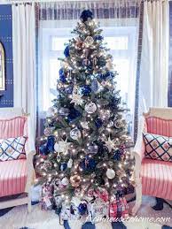 The dark shade of blue will go perfectly with any deep red and dark green christmas decor you may already own! 15 Elegant Christmas Tree Decorating Ideas Glam Christmas Tree Blue Christmas Tree Decorations White Christmas Tree Decorations