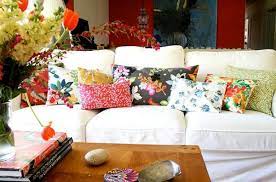 Choose pillows with complementary colors for a bold and vibrant look. A Simple And Forever Stylish Combination White Sofa And Colorful Pillows