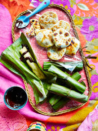 It is our culture and tradition of giving gifts! Still Life With Tray Of Filipino Budbud Kabog And Piaya Pasalubong Stockphoto
