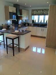 The tiles you choose to fix on your floor or wall play an important part of the overall room design. Love These Shiny Cream Kitchen Floor Tiles X Kitchen Tiles Design Modern Kitchen Flooring Modern Kitchen Tiles