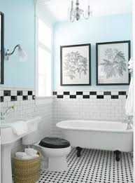 A narrow band of blue tile underlines the composition; Black And White Tiled Bathroom Light Blue Walls But I D Probably Make Them Close White Bathroom Designs White Bathroom Tiles Bathroom Makeovers On A Budget