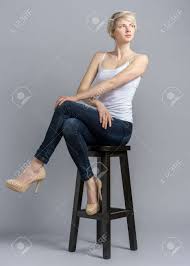 Every army that wants to win must adopt a strategy… Model On Stool With Crossed Legs And Arms Studio Photoshoot Stock Photo Picture And Royalty Free Image Image 118624725