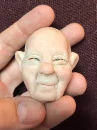 My daughter Julia LePine sculpted this face! She is only 7!!!! This girl is  freaking me out!!! She asked me to show her the steps of making Mrs. Claus,  I showed her