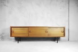 This Classic Sideboard Was Manufactured In Denmark During The 1960s It Is Made From Wood And Teak Veneer It Has Rounded Twist Off L Teak Holzkisten Teak Holz