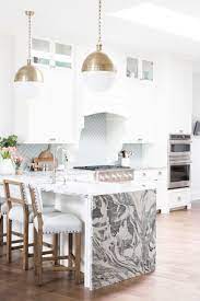 Impressive kitchen islands are becoming more and more popular these days. A 1990 S Townhouse Is Transformed Into A Timeless Modern Home Kitchen Design Trends Kitchen Design Interior Design Kitchen