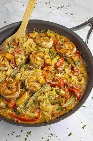 Rasta Pasta With Shrimp In A Pan Ready To Serve Rasta Pasta Unique Pasta Recipes Jamaican Recipes