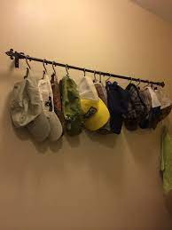 A Hat Rack To Keep The Collection Organized Use A Curtain Rod And Shower Curtain Hooks Keeps Them Nice And Tidy Shower Curtain Hooks Hat Rack Curtain Hooks