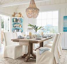 Pillows layered on the bench provide texture and warmth. 21 Coastal Designer Dining Rooms Coastal Decor Ideas Interior Design Diy Shopping
