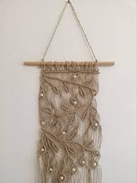 Like any skill, macrame takes time, patience and of course practice! Jute Macrame Wall Hanging With Natural Wooden Beads Boho Etsy Jute Macrame Wall Hanging Macrame Wall Hanging Patterns Macrame Wall Hanging