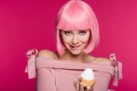 From gloves and socks to earrings and bleach kits Happy Sensual Girl Biting Lip And Holding Sweet Cupcake Isolated On Pink Free Stock Photo And Image
