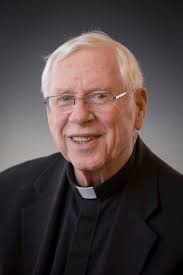 Mourners fill Baldwinsville church to honor Father John Finnegan