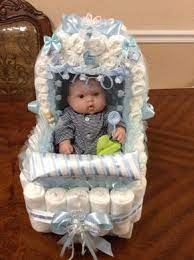 Elegant Diaper Carrige Baby Shower Gift Elegant Centerpiece Baby Boy Diaper Stroller Boy Baby Sh Baby Shower Gifts Baby Shower Diapers Diaper Stroller
