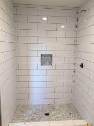 Large Subway Tile With Mosiac Shower Pan And Niche Best Bathroom Tiles Bathroom Tile Designs Farmhouse Shower