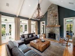 Rustic Living Room With Hardwood Floors Cathedral Ceiling Stone Fireplace Exposed Bea Farm House Living Room Beams Living Room Cathedral Ceiling Living Room