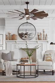 A chandelier ceiling fan adds function and glamourous style; Ceiling Fans In Living Rooms Novocom Top