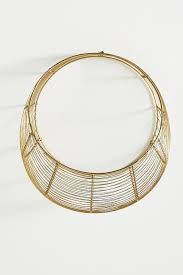 This sturdy wire bin does not need additional hardware; Loretta Round Gold Wire Hanging Basket