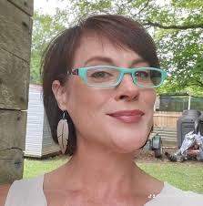 This is a family photo of James Garner and Sarah Fick. Sarah Fick was the  oldest child of 15 children of McIntyre Fick and Hannah Burger. She was  born in 1833 in