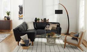 Creating living room décor in a modernist vain is a practice in less being more. Decorating With Black Furniture In Your Living Room Overstock Com