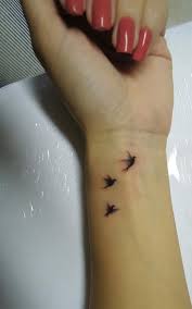 Three Birds In Flight Tattoo Pin By Ladyvampzdee On Tattoo Ideas Simple Wrist Tattoos Wrist Tattoos For Women Tattoos For Daughters