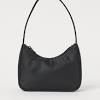 It is made out of floral embossed faux patent leather and has silver toned hardware. 1