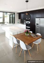 Integrating A Table Into Your Breakfast Bar Saves Room And Is Great For Entertaining Contemporary Kitchen Design Modern Kitchen Contemporary Kitchen Cabinets