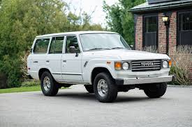 The sale includes original sales documentation, service records, and manufacturer's literature, as well as a window sticker that shows a $14,253 total price. For Sale 1983 Toyota Land Cruiser Fj60 White Tan 177k Miles Massachusetts Ih8mud Forum