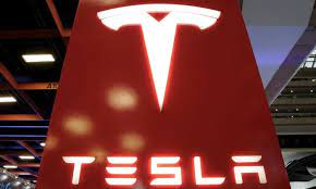 Tesla stock surges despite record loss as Elon Musk apologizes to analysts  | Tesla | The Guardian
