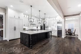 Rustic farmhouse kitchen with white shaker cabinets and marble countertop. Traditional Custom Farmhouse Kitchen White Shaker Cabinets Highcraft