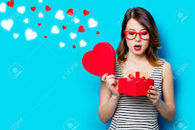 A magnetar is a neutron star with a strong magnetic field and i believe this is what is meant to describe being pulled or drawn in. Portrait Of Beautiful Young Woman With Heart Shaped Box And Gift On The Wonderful Blue Studio Background And Abstract Hearts Stock Photo Picture And Royalty Free Image Image 103181033