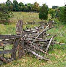 You get a natural look with the benefit of naturally occurring resistance of cedar features of a split log fence: Adding A Split Rail Fence To Deter Deer In The Garden Rail Fence Split Rail Fence Fence Design