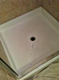 Cracked bathtub and shower floor before repair and refinishing. How To Fix A Cracked Shower Pan Colorado Tub Repair