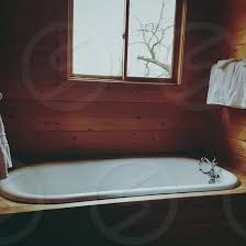 Our rustic bathtub tray caddy is perfect for your antique clawfoot or standard tub. Tub Bathtub Wood Wooden Tub Wood Bathtub Sunken Tub Rustic Cottage Bathroom Cottage Bathtub Rustic Bathtub Bathtub And Windows By Heather Vargas Photo Stock Snapwire