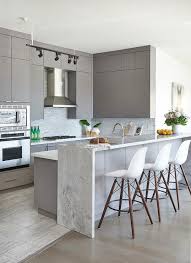 Granite characteristics include strength and durability. Super White Granite Waterfall Countertop Transitional Kitchen