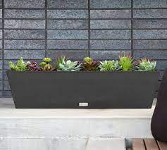 Exercise your green thumb with window boxes, hanging baskets or railing planters around the house. Hevea Outdoor Window Box Planters Pottery Barn