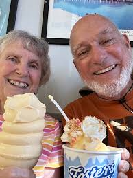 What is the cost of using Fosters for grocery delivery in the Cayman  Islands and how do they handle perishables?