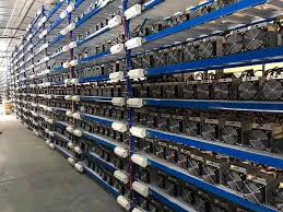 A warehouse full of asic bitcoin miners run 24/7 to manufacture bitcoin. Calculating Bitcoin Mining Profits Crypto Capers