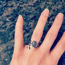 A small, and surprisingly detailed, revolver is pictured in black and gray ink on the wearer's index a skull, located on the wearer's ring finger, is embellished with designs and a cross reminiscent of the. Top 75 Best Ring Tattoo Ideas 2021 Inspiration Guide